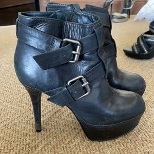 Black heeled leather booties